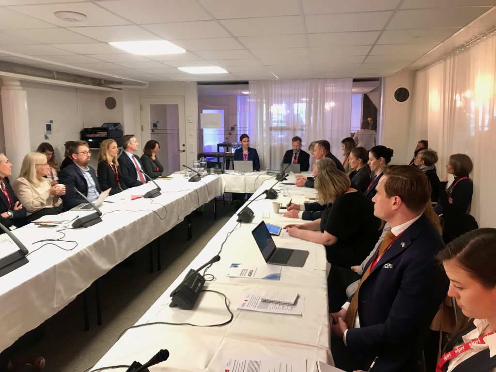 People around a table in a meeting room